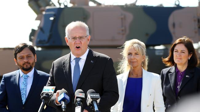 Liberal candidate Manish Patel, Prime Minister Scott Morrison, Liberal candidate Stephanie Asher and Senator Sarah Henderson at the Hanwha howitzer plant in Avalon. Picture: Alison Wynd