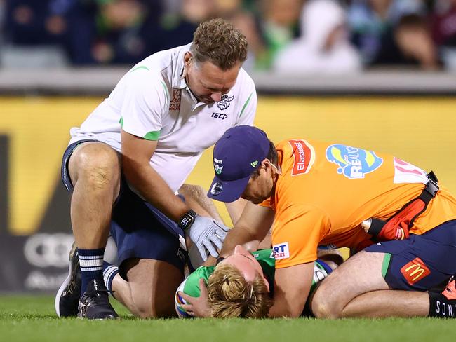 CANBERRA, AUSTRALIA - APRIL 14: Zac Hosking of the Raiders is treated for a shoulder injury during the round six NRL match between Canberra Raiders and Gold Coast Titans at GIO Stadium, on April 14, 2024, in Canberra, Australia. (Photo by Mark Nolan/Getty Images)