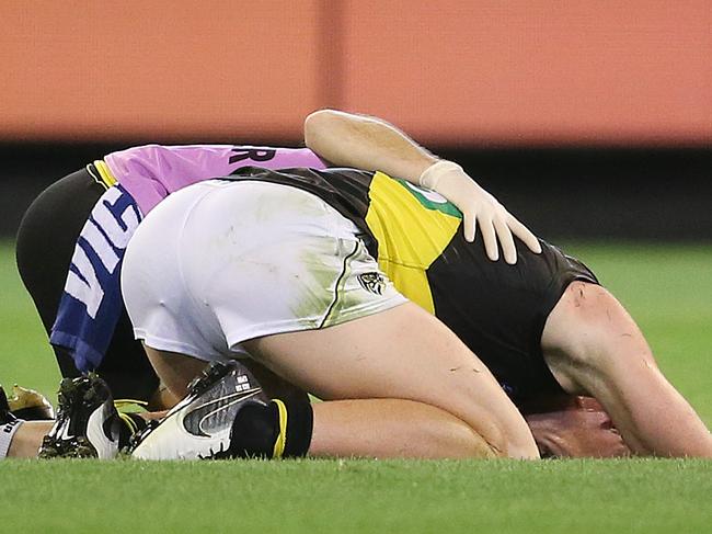 AFL Round1. Carlton vs Richmond at the MCG.   Jack Riewoldt of the Tigers downed off the ball 2nd qtr   . Pic: Michael Klein