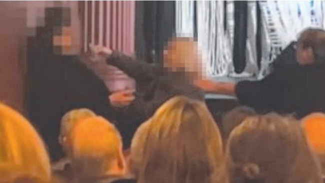 A still from a video showing a confrontation between a concert goer and protester at the Deborah Conway show at the Playhouse Theatre in Hobart.