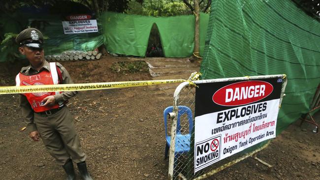 Thai police stand guard near the cave. Picture: AP.