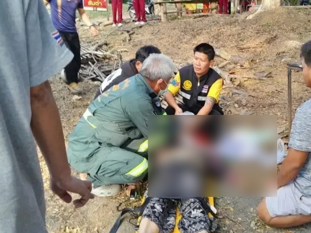 Paramedics tend to Kia Sae-wang, 58, after she was struck by a dirt bike. Picture: AsiaPacificPress via ViralPress