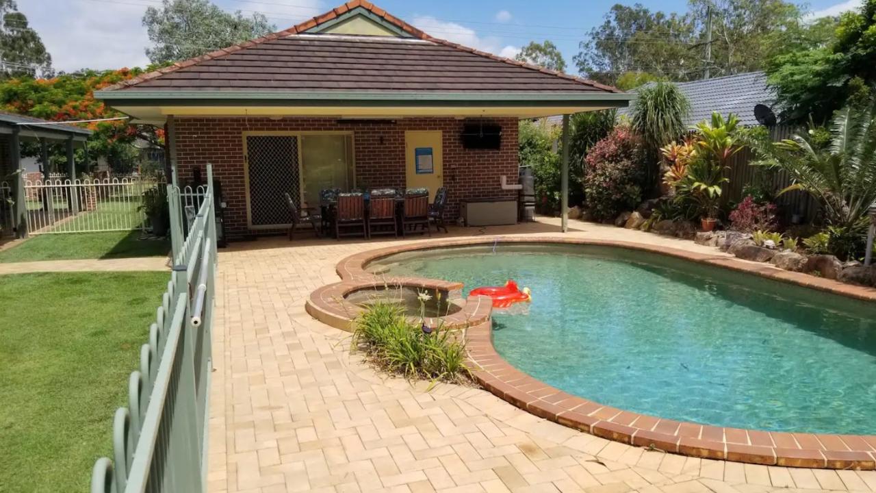 This Moreton Bay poolside guesthouse with its own covered courtyard area is available for just $124 per night. Picture: Airbnb