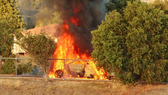 A car fire near Weston Park, Austins Ferry this morning. Photo: Kelvin Ball