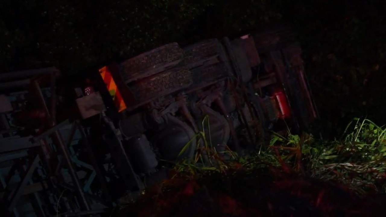 Truck carrying groceries rolls on Bruce Hwy