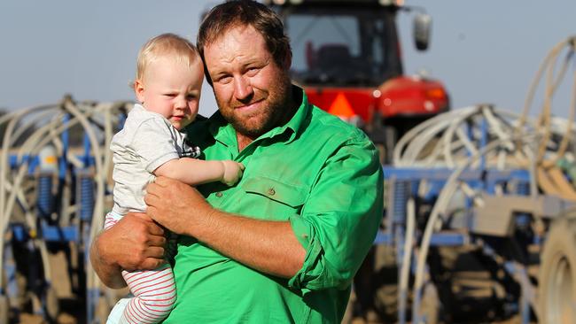 New crop: Luke Milgate, with son Alexander, on the family’s farm at Serpentine in central Victoria. Picture: Dale Webster