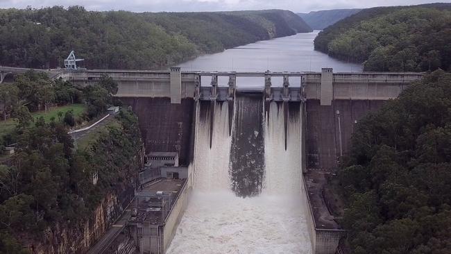 Warragamba Dam spilling flood waters over its wall in March.