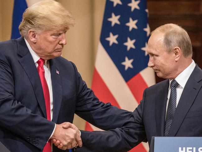 HELSINKI, FINLAND - JULY 16: U.S. President Donald Trump (L) and Russian President Vladimir Putin shake hands during a joint press conference after their summit on July 16, 2018 in Helsinki, Finland. The two leaders met one-on-one and discussed a range of issues including the 2016 U.S Election collusion.  (Photo by Chris McGrath/Getty Images)