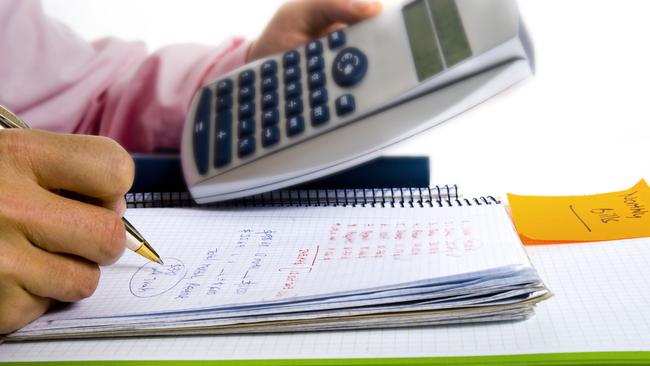 Man with Calculator and the cost of Living