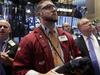 Trader Ryan Falvey, center, works on the floor of the New York Stock Exchange Friday, Oct. 3, 2014. Strong U.S. jobs data drove stocks higher in early trading Friday. (AP Photo/Richard Drew)