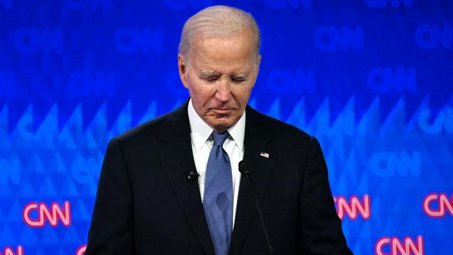 TOPSHOT - US President Joe Biden looks down as he participates in the first presidential debate of the 2024 elections with former US President and Republican presidential candidate Donald Trump at CNN's studios in Atlanta, Georgia, on June 27, 2024. (Photo by ANDREW CABALLERO-REYNOLDS / AFP)