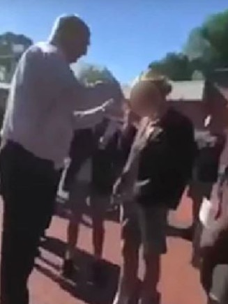 The deputy principal was filmed cutting the student's hair.