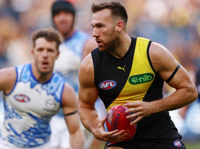 MELBOURNE, AUSTRALIA - MAY 18: Noah Balta of the Tigers runs with the ball during the round ten AFL match between Richmond Tigers and North Melbourne Kangaroos at Melbourne Cricket Ground, on May 18, 2025, in Melbourne, Australia. (Photo by Morgan Hancock/Getty Images)