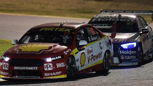 Scott McLaughlin leading Shane van Gisbergen  during Supercars Sydney SuperNight 300 race on Saturday. Picture: Getty Images