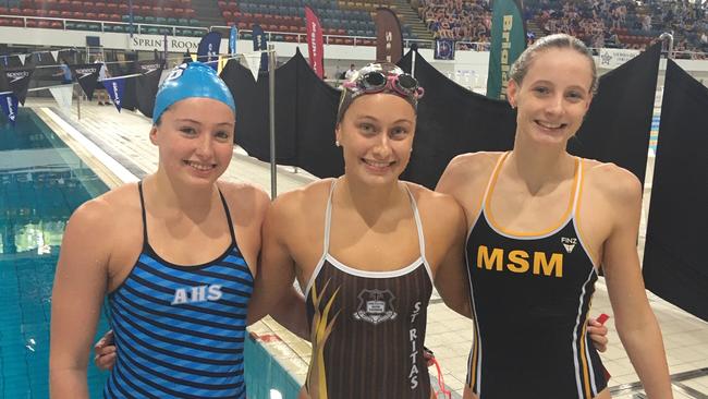 Bronte Job (All Hallows), left, with Nicole Sanders (St Rita's) and Casey Hannah (Mt St Michael's) at the CaSSSA swimming carnival.