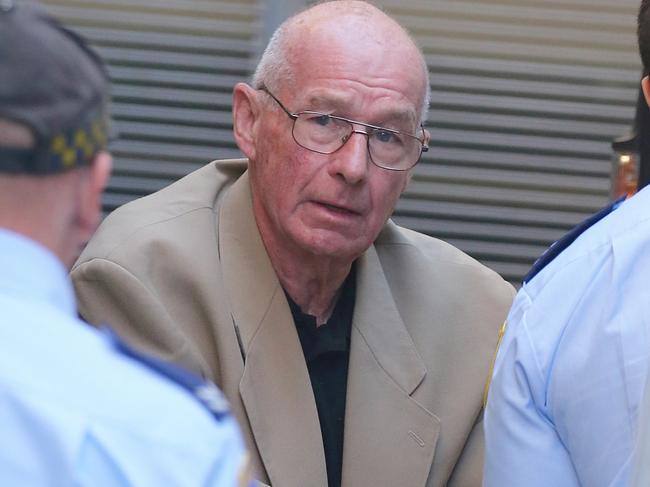 Roger Rogerson arrives at the supreme court for his trial.