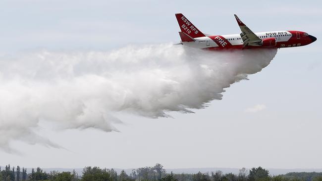 A Large Air Tanker drops water during a demonstration flight at RAAF Base Richmond, Sydney, in 2020. All but one of the LATs in operation in Australia are leased from North America during their winter. Picture: Ryan Pierse/Getty Images