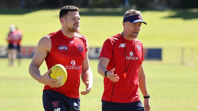 Demon Steven May talks with Darren Burgess in grand final week.