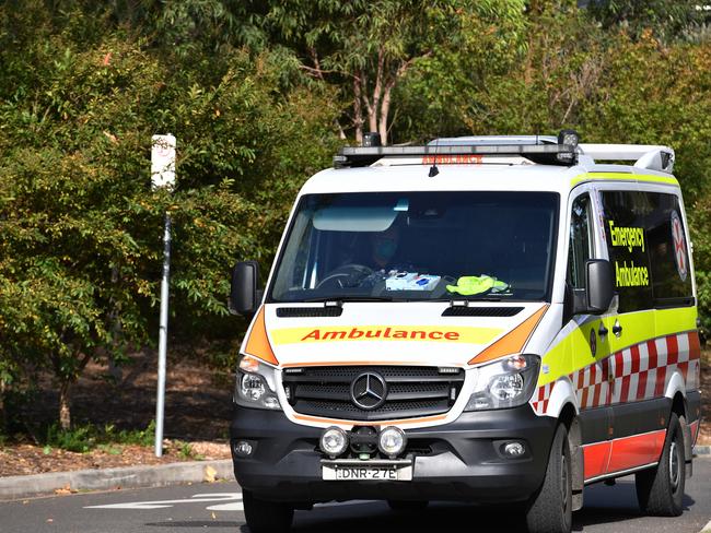 An ambulance is seen leaving Anglicare Newmarch House. Picture: AAP