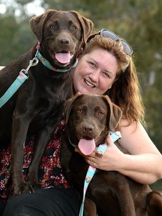 13/10/14. Many quirky dog names have been registered over the past year including Suzanne Larby's chocolate Labradors Mayhem and Kaos. Suzanne Larby with her two dogs at Happy Home Reserve Dog Park. Pic. Noelle bobrige