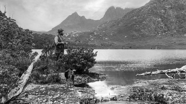 Gustav Weindorfer, and his dog Flock at Cradle Mountain in, 1922. Picture: Stephen Spurling/courtesy of the Queen Victoria Museum and Art Gallery