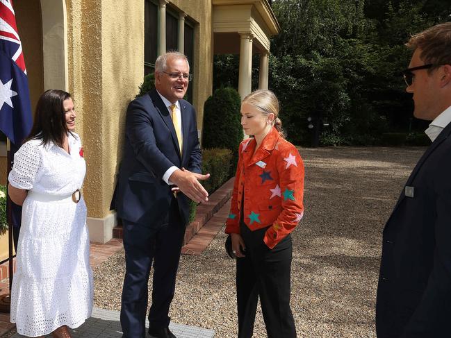 The Prime Minister reaches out his hand to Grace Tame’s fiance. Picture: NCA NewsWire / Gary Ramage