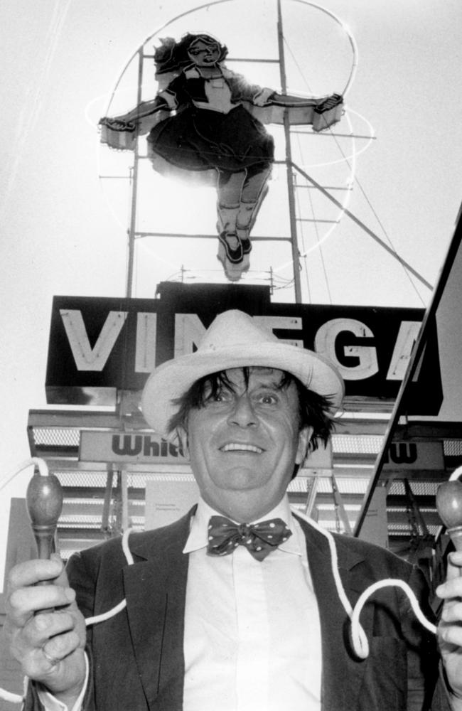 Barry Humphries with the sign in 1990. Picture: Tony Terry