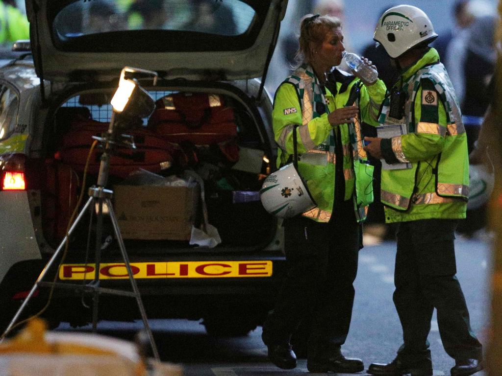 Emergency service workers at the scene of a huge fire in Grenfell Tower. Picture: AFP Photo/Daniel Leal-Olivas