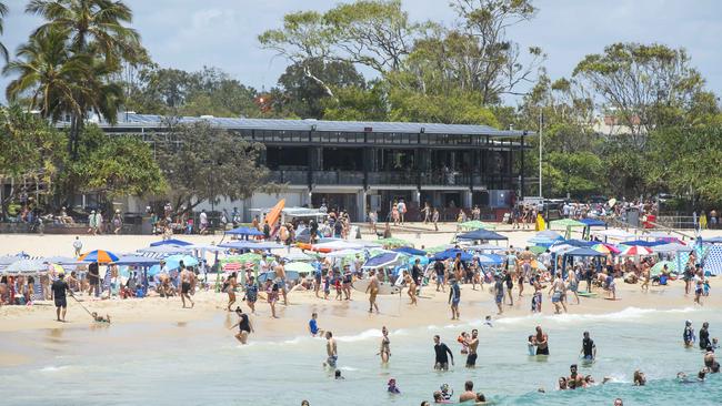 Crowds pack in front of Noosa Surf Club at Noosa Main Beach. Picture: Lachie Millard