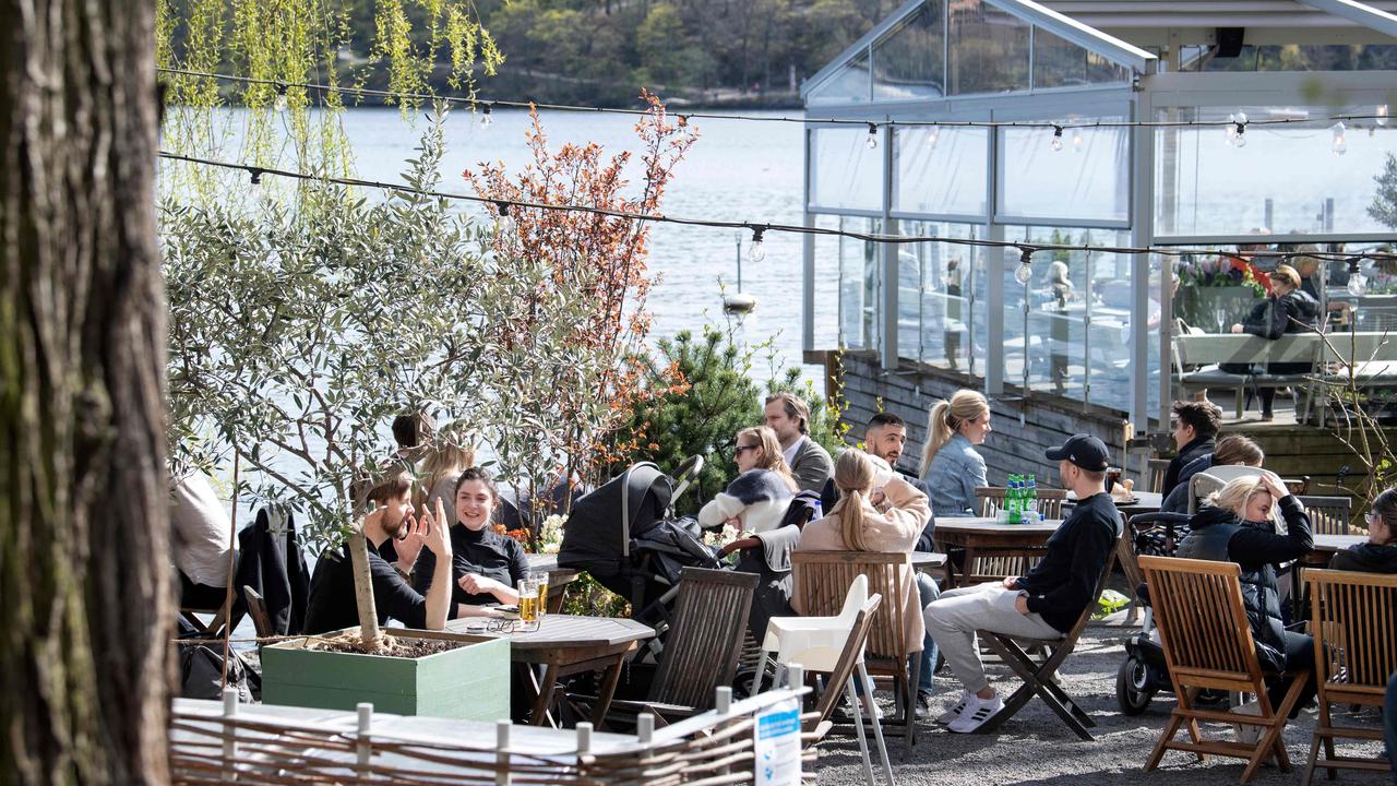 Stockholm locals enjoying the spring sun at an outdoor restaurant on April 26. Picture: Jessica Gow/AFP