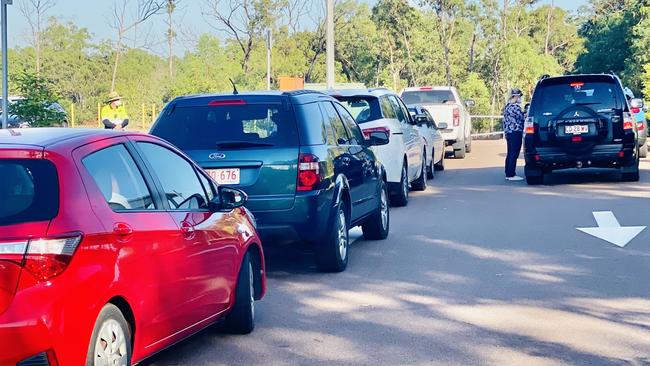 Cars line up for Covid-19 testing outside the Marrara netball stadium this morning. Picture: Gary Shipway