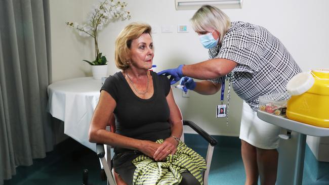 Clinical nurse consultant Nikki Lane delivers one of the state’s first COVD vaccinations on March 9. Picture: Nikki Davis-Jones