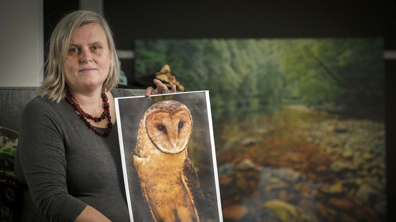 Bob Brown Foundation campaign manager Jenny Weber holds a picture of Tasmanian Masked Owl, a species that is vulnerable to extinction at the proposed MMG tailings dam near Rosebery. Picture: Chris Kidd