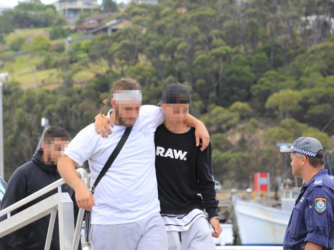 Passengers from the Carnival Legend leave the cruise ship in Eden, NSW.