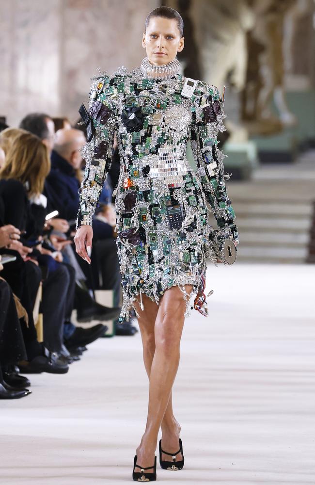 A model walks the runway during the Schiaparelli Haute Couture SS 2024, showcasing a look made with tech waste from a pre-iPhone era. Picture: Estrop/Getty Images