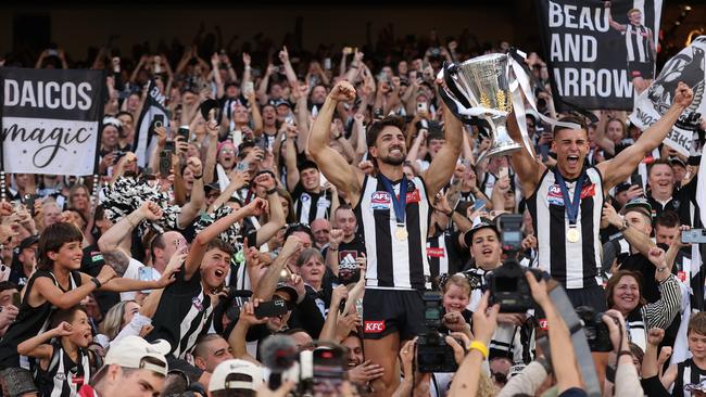 Josh and Nick Daicos celebrate with Collingwood fans after the win. Picture: Robert Cianflone/AFL Photos