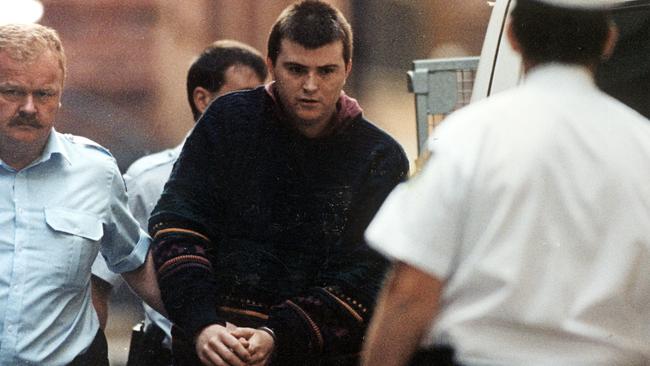 Frankston Serial Killer, Paul Denyer, being taken away by police in 1993. Denyer could be released in 2023. Picture: News Corp