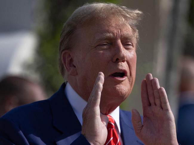 PALM BEACH, FLORIDA - MARCH 19: Former U.S. President Donald Trump speaks to the media after voting at a polling station setup in the Morton and Barbara Mandel Recreation Center on March 19, 2024, in Palm Beach, Florida. Trump, along with other registered Republican voters, cast ballots in the Presidential Preference Primary. There wasn't a ballot or election for Democrats since the Florida Democratic Party only provided the name of Joseph R. Biden Jr.   Joe Raedle/Getty Images/AFP (Photo by JOE RAEDLE / GETTY IMAGES NORTH AMERICA / Getty Images via AFP)