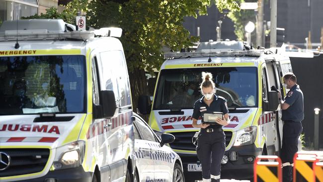 Paramedics restock ambulances with supplies outside the Royal Melbourne Hospital. Picture: NCA NewsWire / Andrew Henshaw