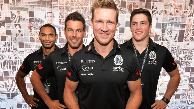 Nathan Buckley with Magpie recruits Travis Varcoe, Levi Greenwood and Jack Crisp. Picture: Rob Leeson