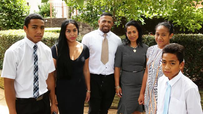 Former rugby league player John Hopoate with his wife Brenda and four of his ten children, Albert, Maile, Pani and Lehi outside their church in Greenwich. Picture: Brett Costello