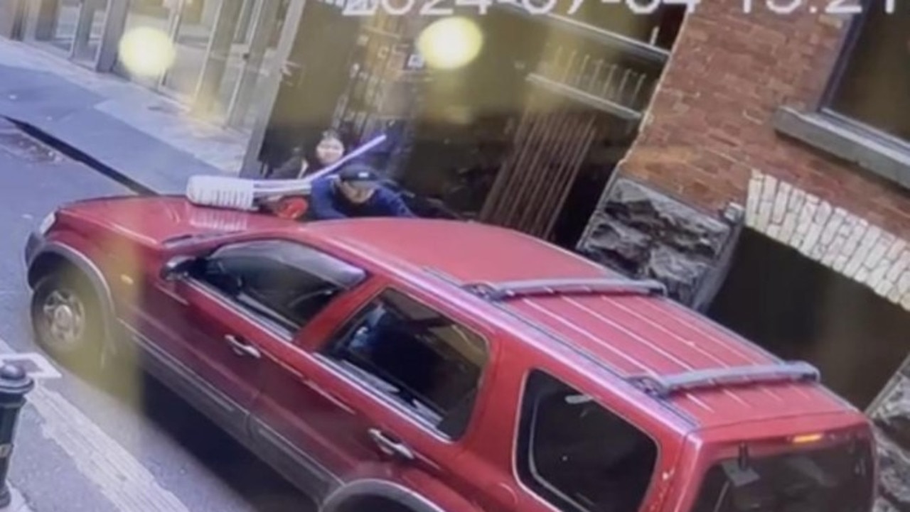 A man tried to stop his car from being stolen by hanging onto the front. Picture: Supplied