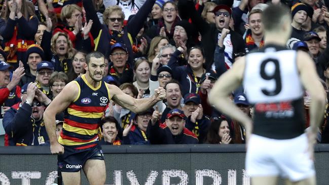 Crows fans celebrate a Taylor Walker goal during August’s Showdown. Picture Sarah Reed