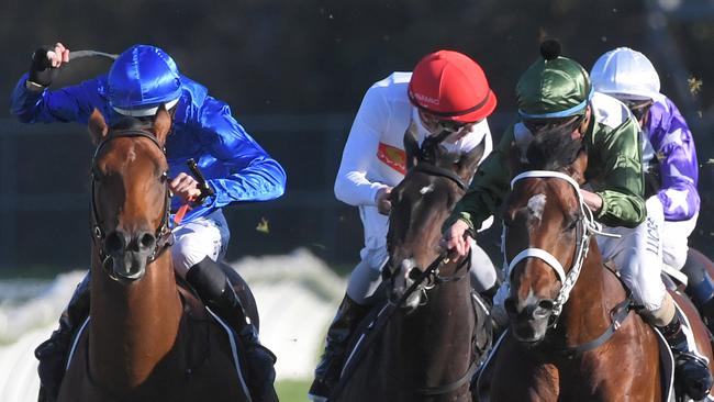 Jockey Hugh Bowman, left, got the best out of Bivouac in a tight finish in the Golden Rose. Picture: AAP