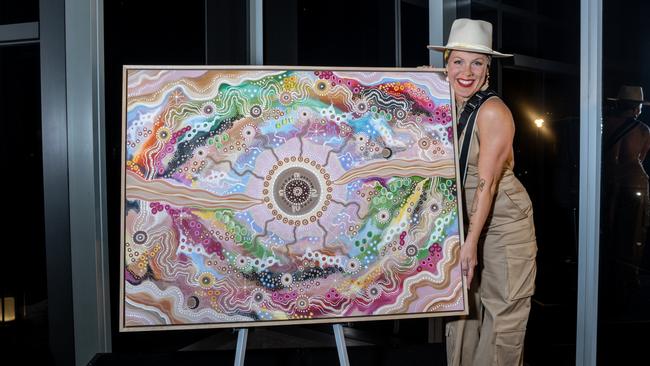 P!nk with a custom art piece from Holly Sanders – to signify not only her connection with Australia, but also her life and all that she does. Photo: Supplied