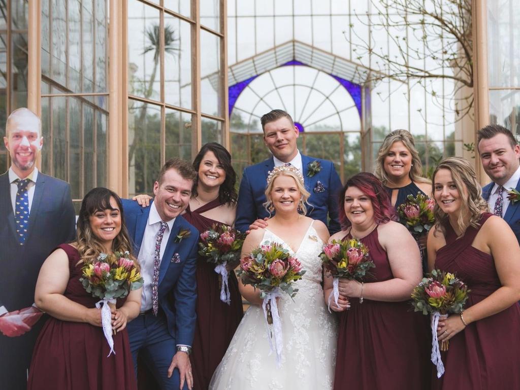 Pauline Trigger and Daniel Long, married at Adelaide Botanical Gardens, Alyce Capurso Photography. One of their groomsmen Daniel McPharlin was unable to attend from Victoria due to travel restrictions. The couple wouldn’t let him miss a moment of the action, though, and he attended as a life size cardboard cut out.