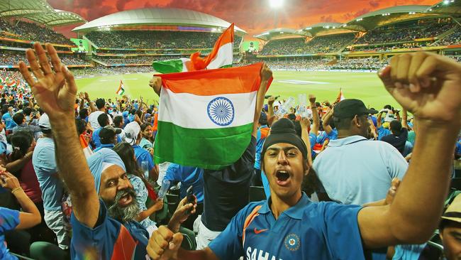 Indian fans celebrate as a Pakistan wicket falls as the sun sets during the 2015 ICC Cricket World Cup match between India and Pakistan at Adelaide Oval on February 15, 2015. Photo Scott Barbour/Getty Images.