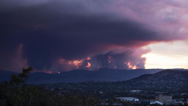 The fire before sunset threatening homes south of Canberra. Picture: Gary Ramage