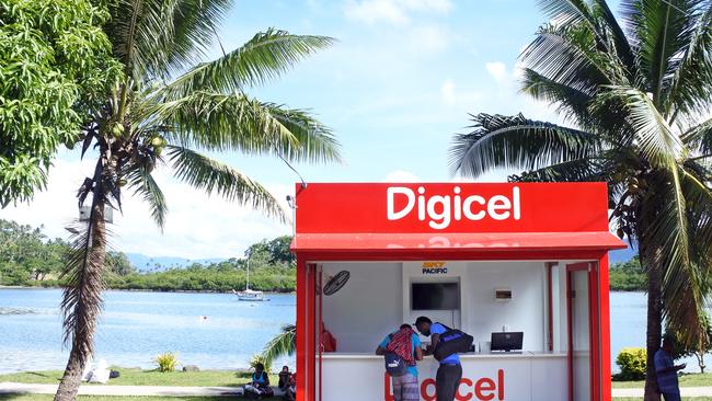 Customers shop at a Digicel store for mobile phones in Savusavu.