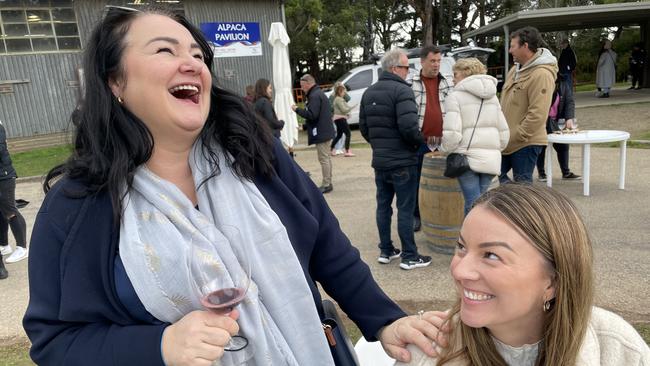 Mia Lloyd, seen here having a laugh with friend Brylie Dauparas, timed her visit from Ireland to coincide with the Winter Wine Fest. Picture: Lucy Callander